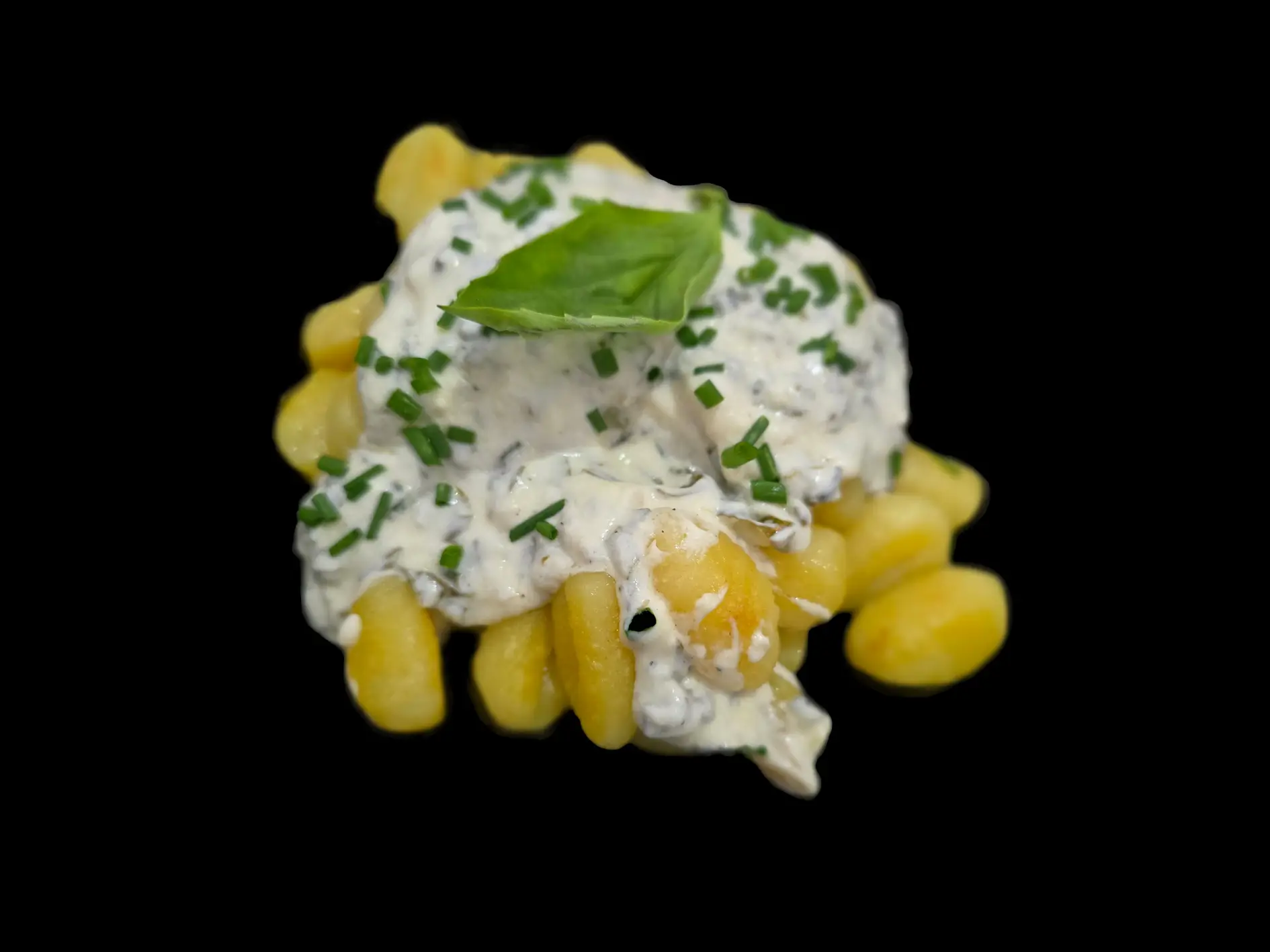 Gnocchis à la crème aux herbes, garnis de ciboulette et basilic